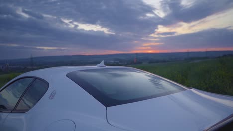 Revealing-shot-of-Maserati-at-dusk