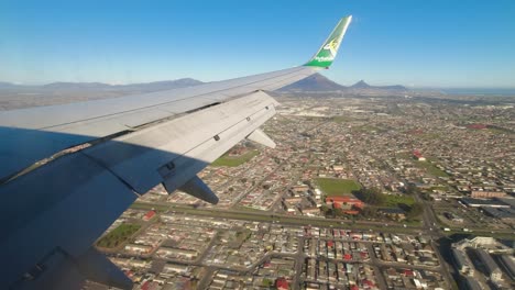 Tourist-on-a-FlySafair-jet-landing-at-Cape-Town,-window-view