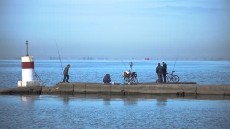 Men-fishing-in-the-sea-and-talking-to-each-other