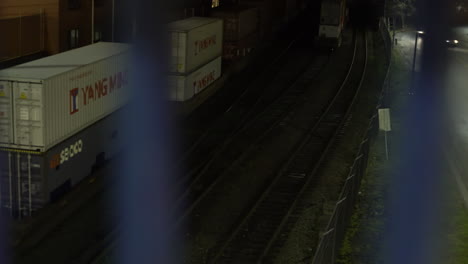 over-bridge-view-of-city-street-and-cargo-train