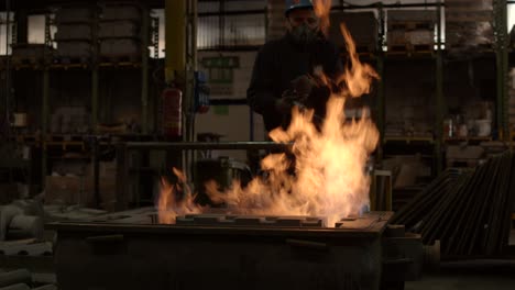 A-worker-with-a-flamethrower-working-on-a-refractory-mold