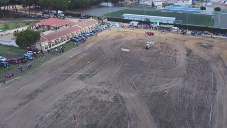 Aerial-tilt-over-Iberlince-Hispalis-dirt-race-course-in-Hinojos,-Spain