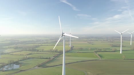 Aerial-view-of-a-windturbine-countryside-in-the-rising-sun-2