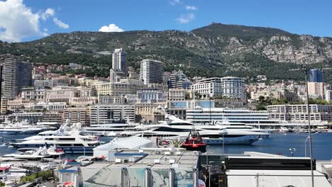 Port-Hercule-viewed-form-a-TV-set-up-for-the-Formula-1-Monaco-Grand-Prix,-showing-Monaco-and-Monte-Carlo-with-yachts-in-the-harbor-visiting-the-French-Riviera