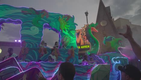 People-throwing-candy-and-necklaces-from-a-big-truck-at-a-parade