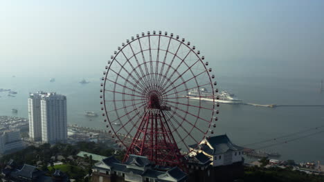 Panoramic-of-downtown-Da-Nang-Vietnam-overlooking-the-Sun-Wheel-and-South-China-Sea,-aerial-orbit