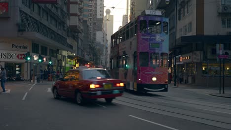 Static-shot-of-one-of-the-main-street-of-Hong-Kong-with-the-tramway-line-on-the-middle-of-the-road-during-the-day