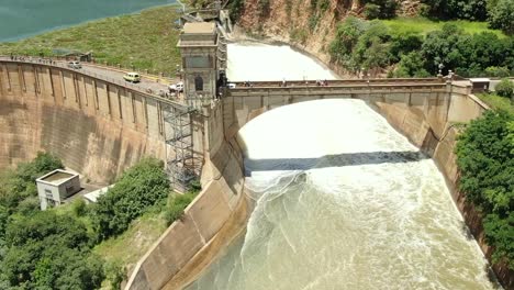 Dam-overflowing-into-river-all-sluice-gates-open