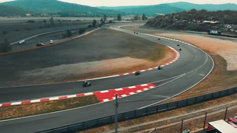 Rotating-drone-shot-of-professional-bikers-racing