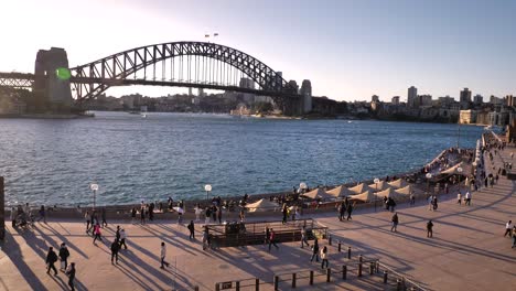 Handheld-footage-of-Sydney-Harbour-Bridge-during-sunset-from-next-to-the-Opera-House