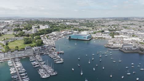 Drone-fly-in-of-Princess-Yachts-shed-in-Plymouth,-UK,-June-2024