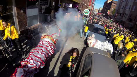 Chinese-dragons,-firecrackers-and-confetti-in-slow-motion