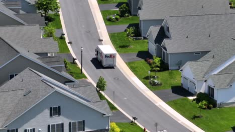 Fedex-Truck-on-street-of-modern-neighborhood-in-USA-during-sunny-day