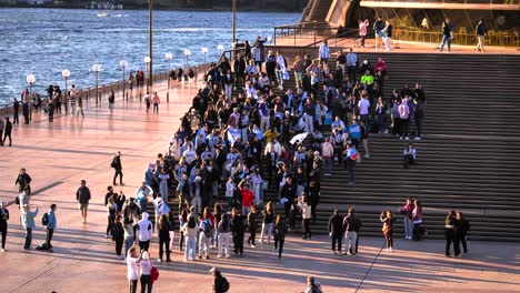 Argentinian-soccer-fans-celebrating-the-16th-Copa-America-win-on-the-steps-of-the-Opera-House,-Sydney,-Australia