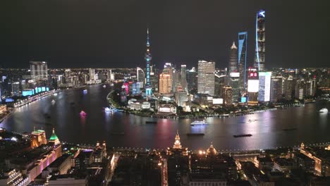 Aerial-Establishing-Drone-above-Shanghai-China-Huangpu-River,-Downtown-at-Night