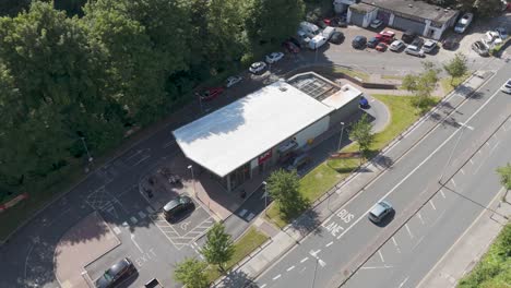 Aerial-view-of-a-KFC-fast-food-drive-through-restaurant-with-adjacent-roads-and-parking-in-Plymouth,-UK