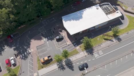 Aerial-view-of-a-KFC-fast-food-drive-through-restaurant-with-adjacent-parking-and-roads-in-Plymouth,-UK