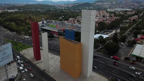 Drone-shot-of-the-back-of-the-"Torres-de-Satélite"-with-a-view-of-Mexico-City