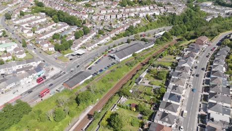 Drone-view-of-a-Lidl-store-with-parking-and-surrounding-neighborhood-in-Plymouth,-UK