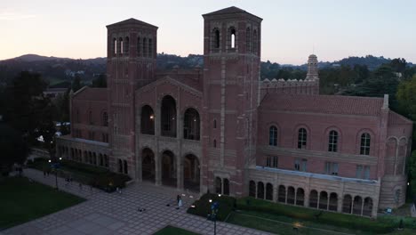 Aerial-wide-rising-shot-of-Royce-Hall-at-sunset-on-the-UCLA-campus-in-Westwood,-California