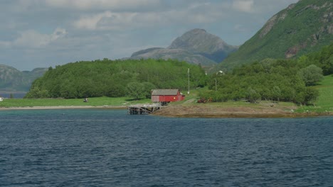 Ferry-crossing-the-Arctic-Circle-with-scenic-views-of-Norway's-coastline,-islands,-and-mountains