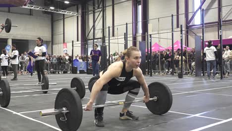 Slow-motion-shot-of-a-female-crossfit-athlete-completing-a-barbell-snatch