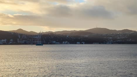 Meridian-Ika-Rere-electric-powered-passenger-ferry-traveling-in-harbour-of-capital-city-of-Wellington,-New-Zealand-Aotearoa