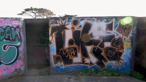 Graffiti-covered-WW2-bunkers-at-The-Massey-Memorial-on-Point-Halswell-in-Wellington,-New-Zealand-Aotearoa