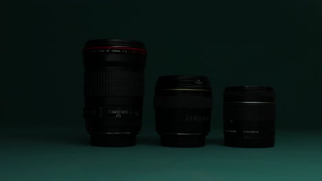 Close-up-of-camera-lenses-against-a-dramatic,-dark-background