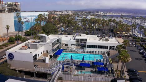 Aerial-close-up-panning-shot-of-the-Bay-Club-at-King-Harbor-Marina-in-Redondo-Beach,-California