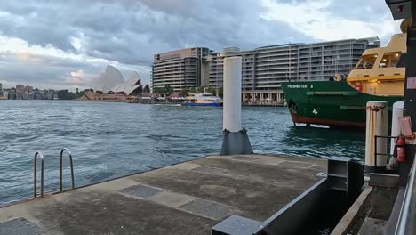 Sydney-Opera-House-and-ferries-moving-around-at-Circular-Quay-in-the-early-evening