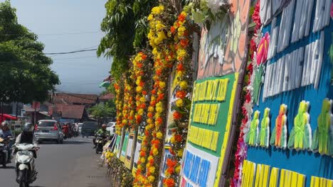 Row-of-sympathy-and-condolence-wreath-on-the-roadside-of-Indonesia