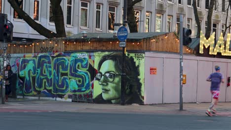 Street-Art-In-Northern-Quarter-of-Manchester-With-Pedestrians-Passing-By