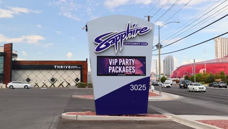 Sign-of-Sapphire-Strip-Club-in-Las-Vegas-with-cars-driving-by-on-the-road