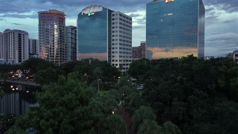 Downtown-Orlando-skyscrapers,-including-PNC-and-Regions-Bank,-reflected-at-dusk