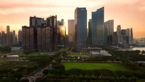 Golden-hour-aerial-view-of-modern-Singapore-skyline-against-vibrant-yellow-sky