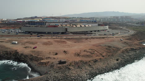 Aerial-view-over-the-Las-Terrezas-shopping-center-in-the-municipality-of-Telde-and-near-La-Restinga-beach