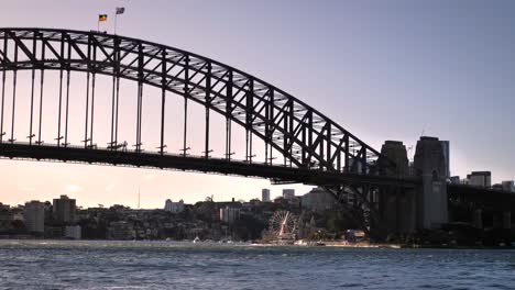 Hand-held-footage,-view-of-Luna-Park-and-the-Sydney-Harbour-Bridge-at-sunset