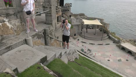 Close-up-shot-of-a-photographer-taking-photos-within-the-Minack-Theater