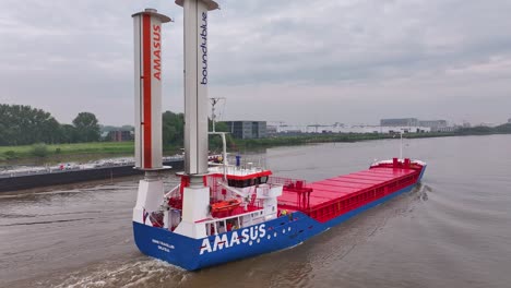 Cargo-Vessel-Of-Amasus-Shipping-In-Zwijndrecht,-Netherlands---Drone-Shot