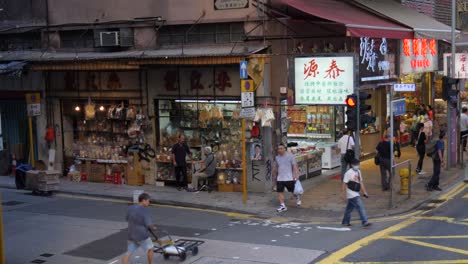 City-life,-business-operations,-pedestrian-crossing,-building-signage