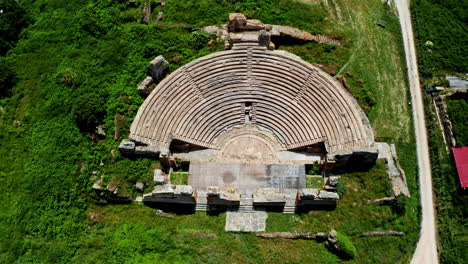 Top-down-aerial-drone-shot-of-the-Theatre-of-Dodona-in-the-Epirus-region-in-Greece