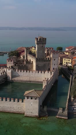 Vertical-Aerial-View-of-Historic-Medieval-Scaligero-Castle-in-Sirmione,-Lombardy,-Italy-on-Lake-Garda,-Drone-Shot