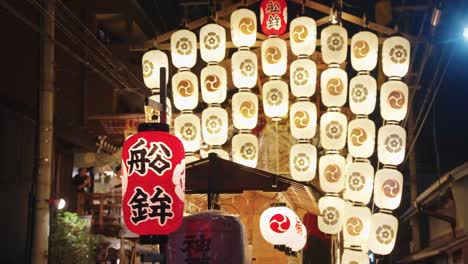 Slow-motion-pan-over-Yamaboko-mountain-float-at-night-illuminating-summer-festival