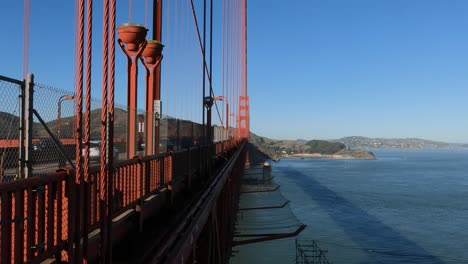 Golden-Gate-Bridge-Suicide-Deterrent-Nets-and-Traffic,-View-Behind-Protection-Fence,-San-Francisco,-California-USA