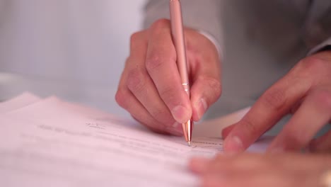 Bride-sign-papers-to-get-married-in-a-wedding-at-slow-motion