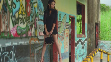 A-young-Latina-in-red-heels-at-a-warehouse-filled-with-skate-ramps