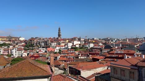 Scenic-cityscape-view,-the-sea-of-red-roofs,-and-Clerigos-Church-Tower-in-Porto,-Portugal