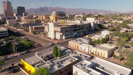 Birdseye-View-Of-Downtown-Tucson,-Arizona-on-Sunny-Desert-Day,-Buildings-and-Neighborhoods-Below