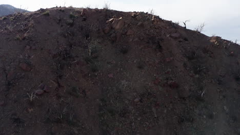 Aerial-view-of-a-barren-hills-with-sparse-vegetation-in-Devil's-Punchbowl